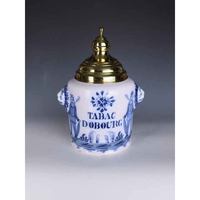 Large dutch delft tobacco jar 'tabac d'obourg' with brass lid, circa 1880–1910 a wonderfully decorative and highly unusual...