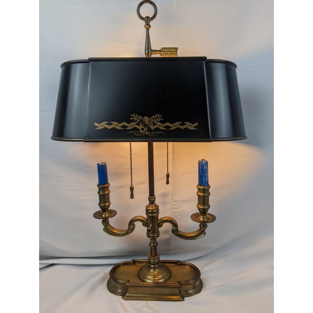 A beautifully crafted vintage Wildwood bouillotte-style table lamp featuring a solid brass-tone frame, elegant black...