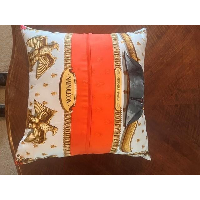 This decorative square throw pillow features the iconic Napoleon design, originally created by artist Phillippe Ledoux for...