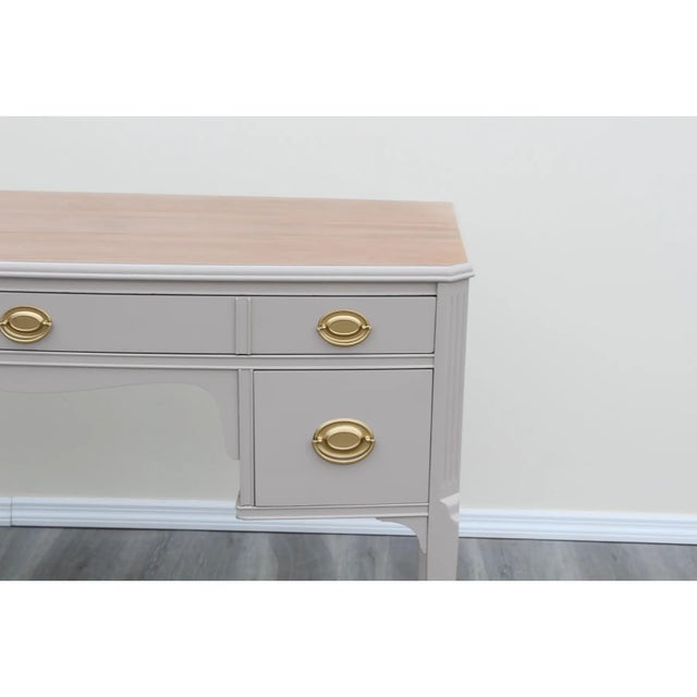 Mid Century mahogany desk of three drawers This desk is newly painted in taupe with satin finish and gold painted...