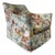 A striking lounge chair by Marge Carson featuring dramatic safari scene upholstery with elephants, camels, leopards, and...