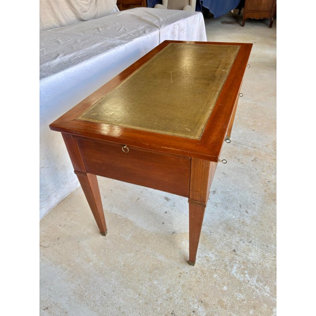 Found in France, this Early 20th Century Writing Desk was crafted from walnut by French artisans in the early 1900's in...