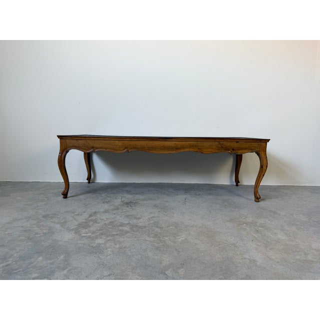 This elegant vintage coffee table showcases classic Italian craftsmanship, clearly marked Made in Italy on the underside....