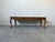 This elegant vintage coffee table showcases classic Italian craftsmanship, clearly marked Made in Italy on the underside....