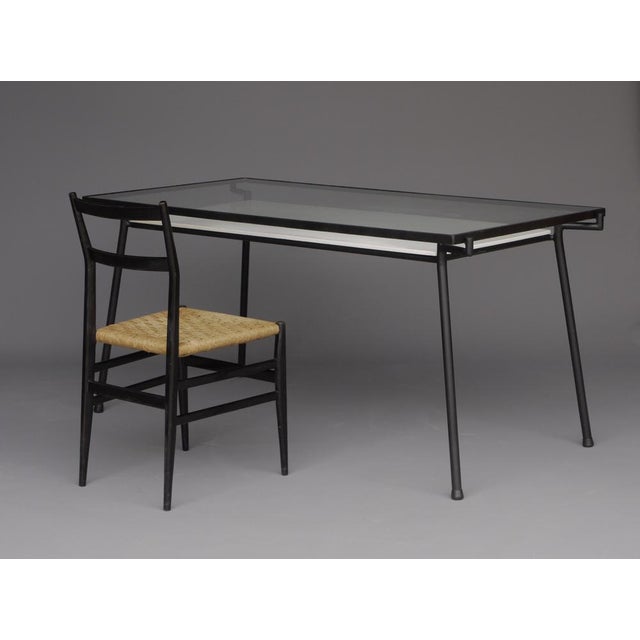 A rare table with under shelf that can also function as a desk. It was designed for the Dutch retailer Metz & Co circa...