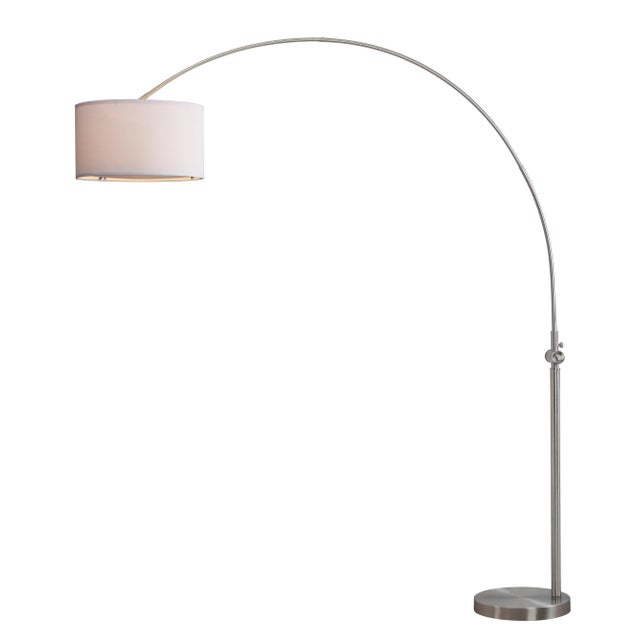 a Arc de Triomphe for your living room, this striking, curvy arc floor lamp is fashioned with a slim silhouette in nickel-...