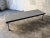 Long wide Bench with chromed metal legs, covered top Tapisom. Designed to support the kitchen modules. Furnishings of the...