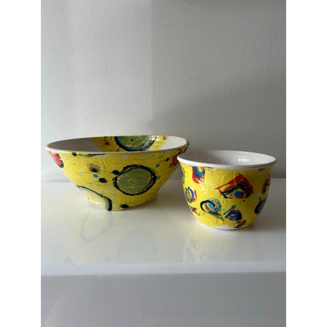 Colorful, abstract expressionist ceramic decorative serving bowls. Bright circular decor is hand painted atop an electric...