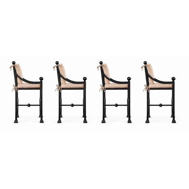 A striking set of four Kreiss Mykonos bar stools combining Mediterranean-inspired elegance with sculptural detailing. The...