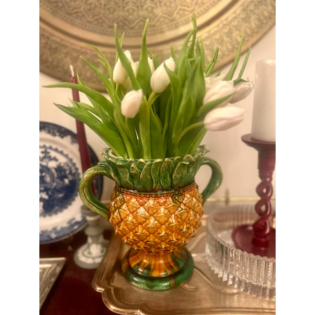 Stunning, highly collectible 19th-century Victorian Majolica pineapple pitcher. This exquisite piece features a...
