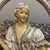 Presenting a charming piece of vintage American decor: an ornate, oval-shaped wall plaque from the Universal Statuary...