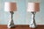 A pair of heavy plaster table lamps featuring a Trompe l'Oeil design that mimics the elegance of knotted, draped fabric....