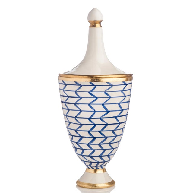 Handmade and hand-painted, this Italian ceramic urn features a geometric blue and white pattern complemented by gold leafing.
