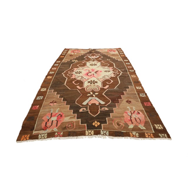 Vintage handwoven decorative kilim rug from Kars region of Turkey. Approximately 50-60 years old. In very good condition.