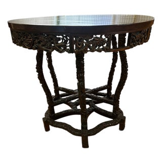 Early 20th Century Chinese Chippendale Style Carved Rosewood Round Center Hall Table With Dragon Motifs For Sale
