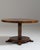 This 1930s Art Deco coffee table from France is made in figured burl veneer as a round table on a stepped, tiered base....