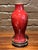 Exceptional Chinese monochrome porcelain baluster-form vase rendered in a rich Sang de Boeuf (oxblood) copper-red glaze....