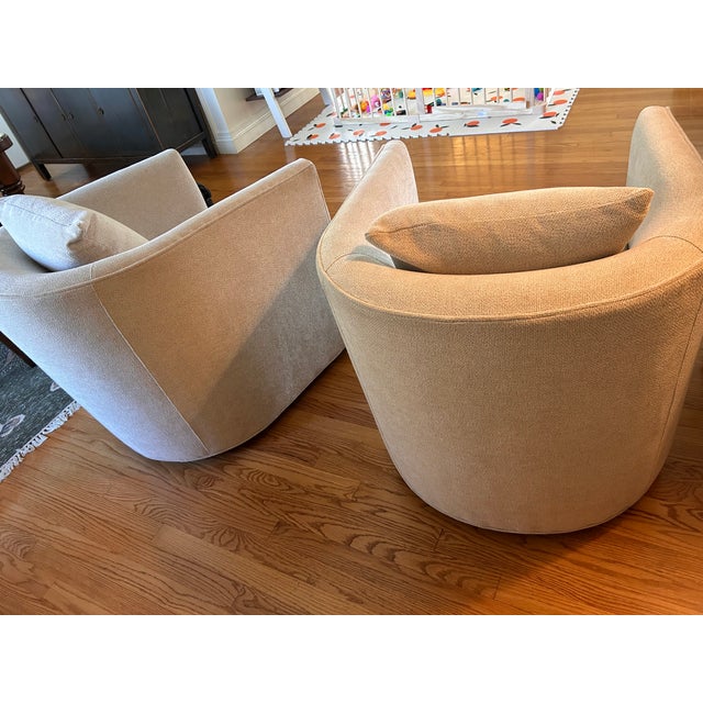 From the Crate and Barrel website: "Crisply tailored with self welting, our Drew swivel chair has all the right moves....