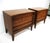A nice pair of walnut nightstands with a gently curved front having long sweeping pulls giving the pieces a sophisticated...