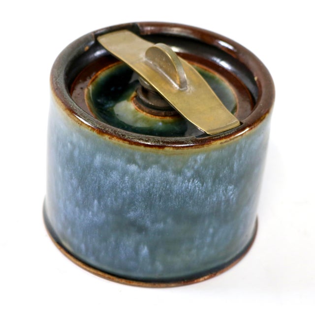 An exceptional piece of English ceramic history: an antique Royal Doulton Lambeth stoneware tobacco jar (humidor) dating...