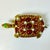 This vintage brass turtle box is enhanced with bejeweled beads in a deep ruby red and faux pearls. He is just lovely and...