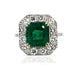 Hand fabricated platinum ring by Keith Davis containg one 5.29 carat fine emerald and 12 round brilliant diamonds weighing...