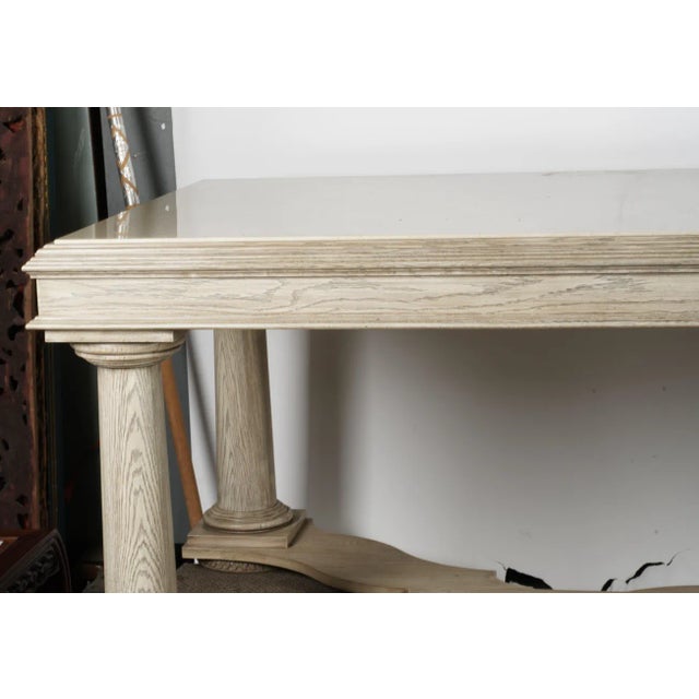 A Nancy Corzine Library Table bleached oak finish with faux stone top; signed to drawer interior Dimensions: 36 x 96 x 48...