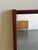 Authentic vintage Danish modern wall mirror crafted from solid teak, showcasing clean Scandinavian lines and warm natural...