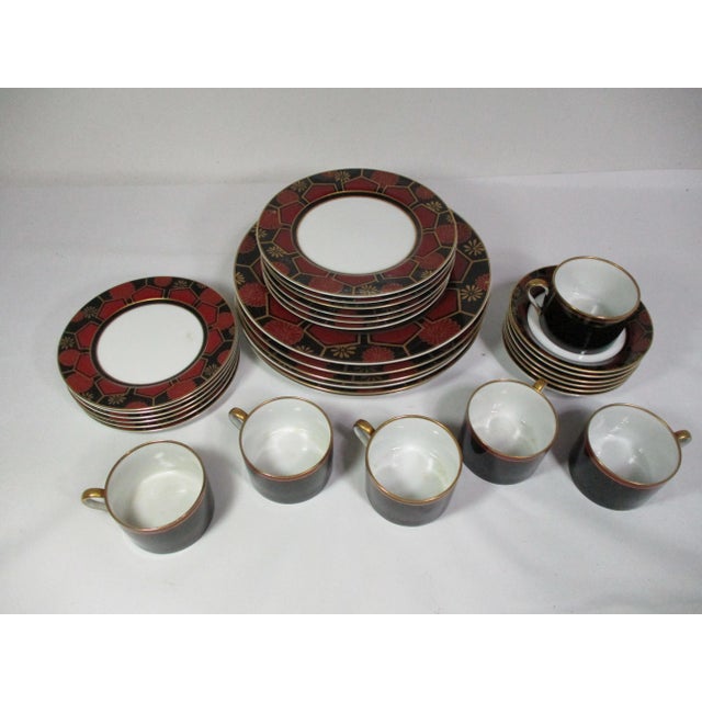 Asian inspired porcelain Fitz and Floyd " Kuruma" pattern dinner service for six. It is decorated with a floral and...