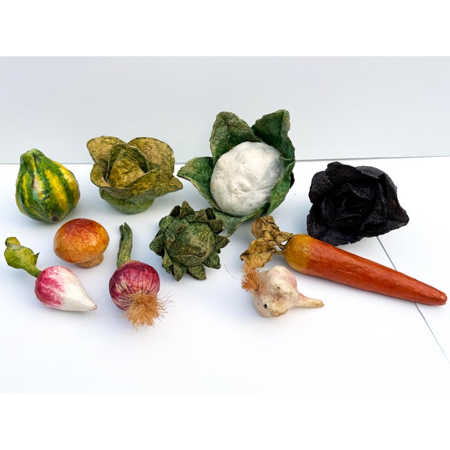 A darling vintage set of handmade papier-mâché vegetables, including acorn squash, lettuce, cauliflower, purple cabbage,...