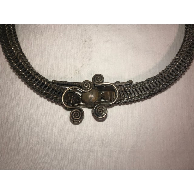 Chinese (most likely ethnic minority Miao) silver ceremonial artifact with scrollwork. One of a collection of six being...