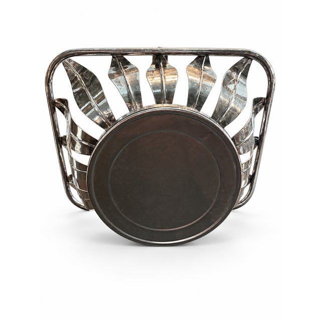 Beautiful mid-century style silver-plated serving basket. Features an openwork slatted leaf/petal design with a raised...
