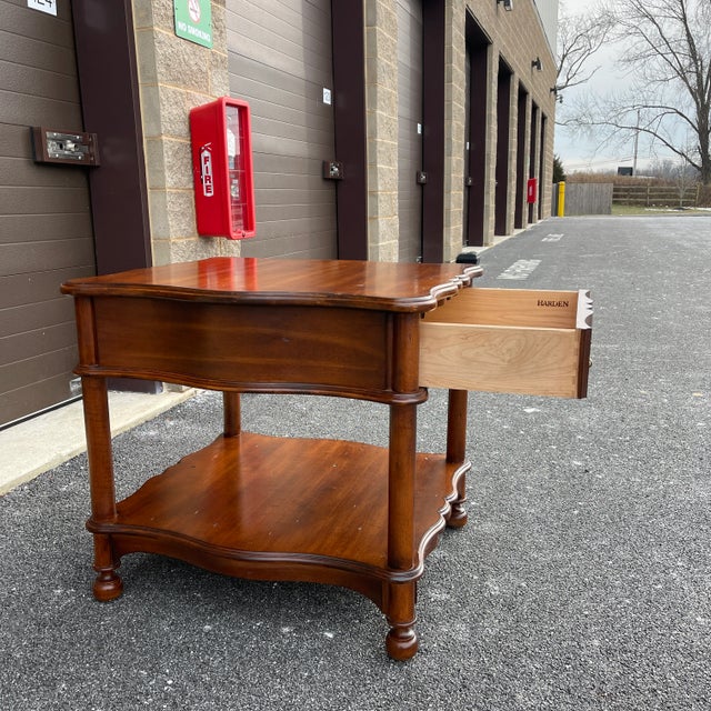 A turn of the century Harden Furniture Contemporary British Colonial cherry serpentine shaped center table having a single...