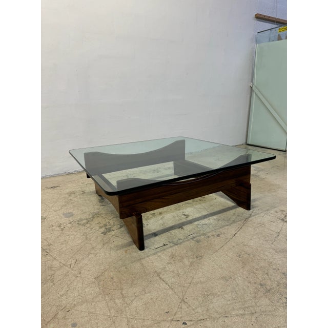 Handcrafted Brazilian Jacaranda Rosewood stacked base coffee table with 3/4” pencil polish glass top circa 1960s.