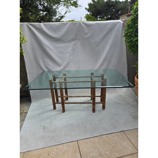 Gorgeous bamboo style rectangular glass table attributed to McGuire. This is perfect for a breakfast room, dining room or...