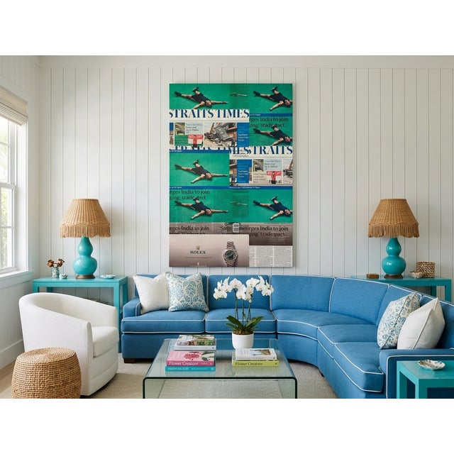 A nearly seven-foot canvas of layered green newsprint, repeated falling figures, and a Rolex advertisement — bold enough...