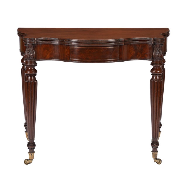 A Federal serpentine-front mahogany game table made in Salem, Massachusetts between 1810 and 1815, attributed to Samuel...
