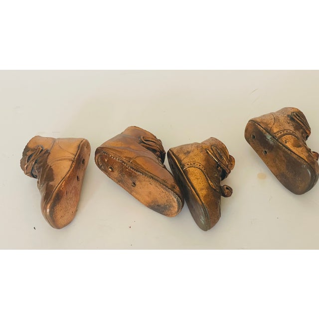 Two pairs antique small baby shoes copper for home decor or pin cushion holders collectibles.