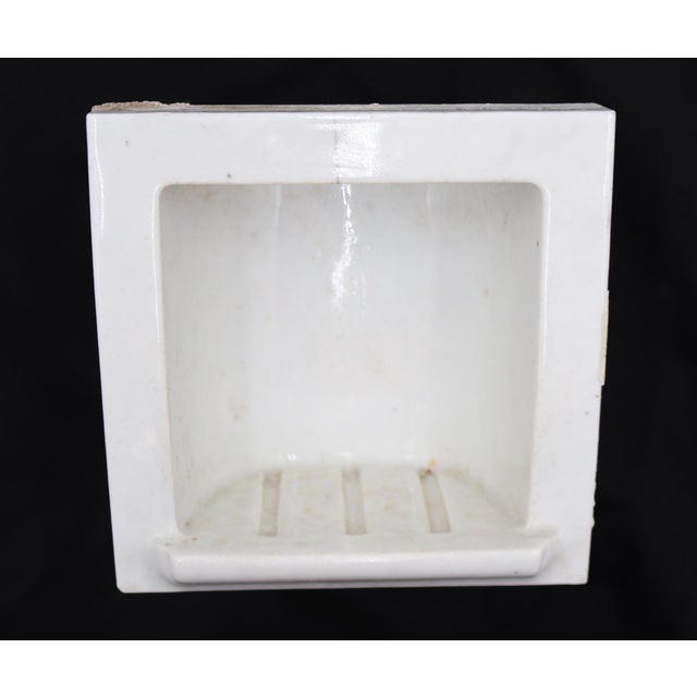 Flush mount square bathroom soap dish made of white porcelain over ceramic with a light crackle surface. Good condition...