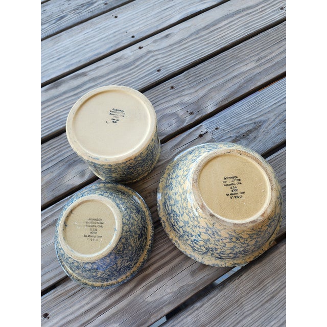 Three Roseville Robinson Ransbottom blue spongeware bowls with speckled glaze. The cylinder bowl measures 4.25"h by 6.5"w....