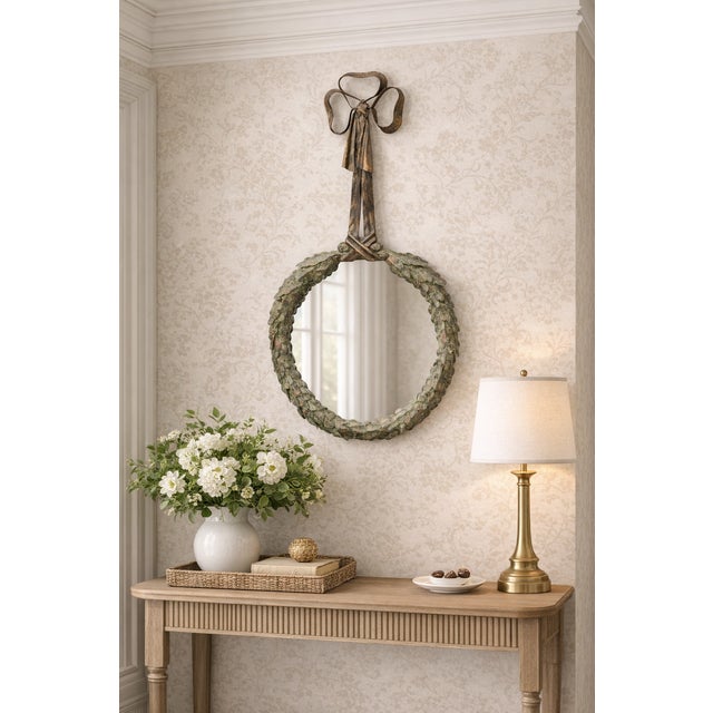 Exceptional Late 20th Century Regency LaBarge Italian Patinated Tole Wreath Bow Metal Wall Mirror with a richly patinated...