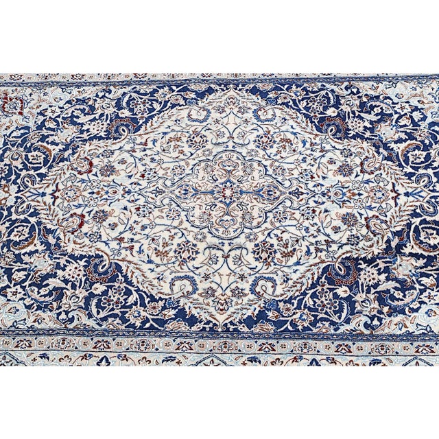 This nain rug is made of cotton and silk on cotton and is in a new and unused state. Very fine and dense link with approx....