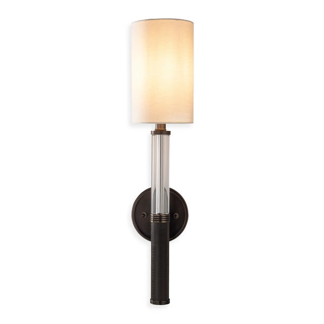 Mid century, modern style narrow column sconce featuring a crystal turning joined with bronze finished knurled textured...