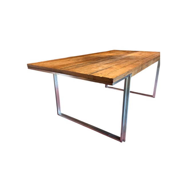 Modern dining table. Reclaimed petrified Amazonian wood top with modern metal legs. Natural wood surface, unfinished. From...