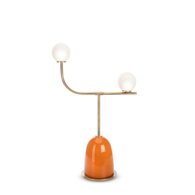 Pins arched table lamp by marioni dimensions: w 52 x d 82 x h 22 cm. Materials: ceramic base and brass stem, with satin...