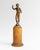 A rare small bronze by Swedish sculptor Tore Strindberg (1882–1968), depicting a nude female figure reaching gracefully...