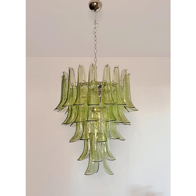 DUTIES FREE A true statement piece of Italian craftsmanship, this stunning Murano glass chandelier features 52 handblown...