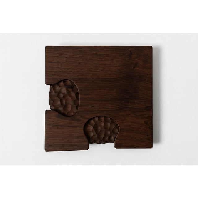 The Vertige coffee table plays on the balance between raw forms and precise lines. Its puzzle-shaped top seems to hang...