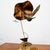 Mid Century Modern abstract solid brass humming bird sculpture with stone base. The subject matter is of a humming bird...