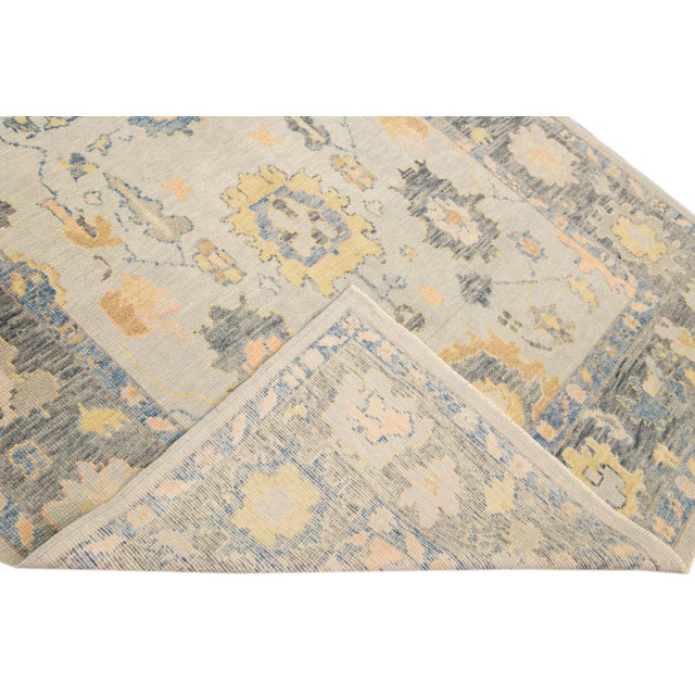 Beautiful modern Oushak hand-knotted Wide wool runner with a gray field. This Oushak rug has multicolor accents all over a...
